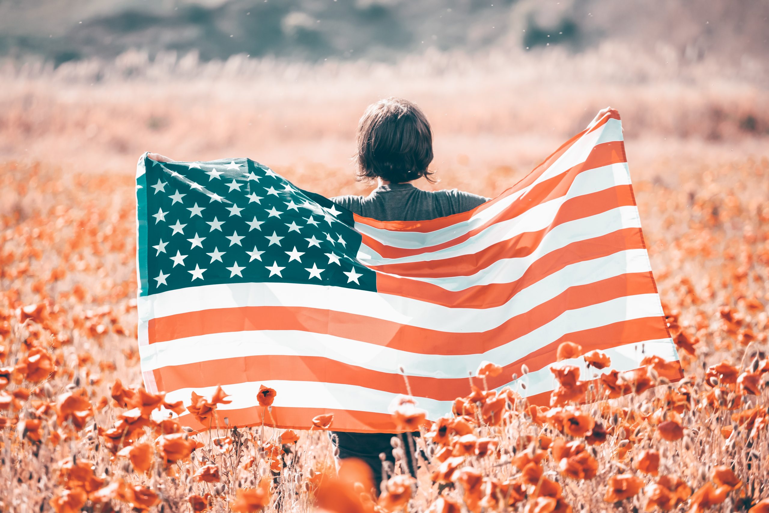 USA citizen with american flag. 4th of July. Freedom. Independen
